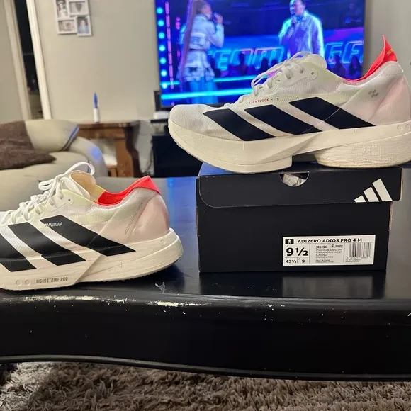 Adidas White and Black Athletic Shoes with Classic Stripes