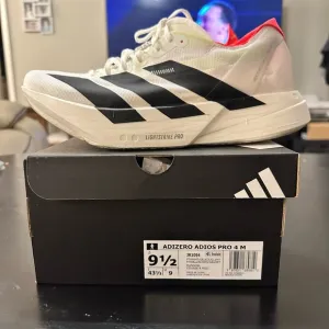 Adidas White and Black Athletic Shoes with Classic Stripes