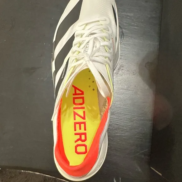 Adidas White and Black Athletic Shoes with Classic Stripes