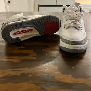 Jordan White and Gray Sneakers with Classic Design