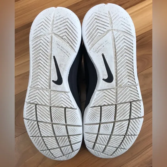 Nike | Youth black high top lace up shoes with white non-marking soles, size 5.5