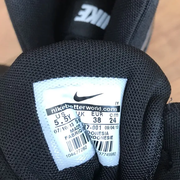 Nike | Youth black high top lace up shoes with white non-marking soles, size 5.5