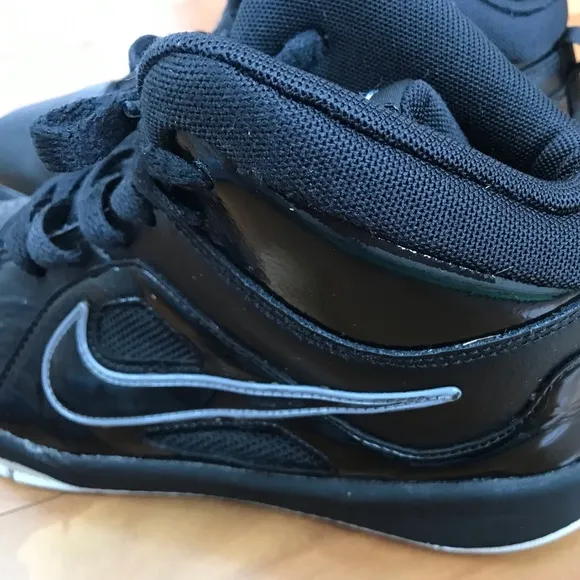 Nike | Youth black high top lace up shoes with white non-marking soles, size 5.5