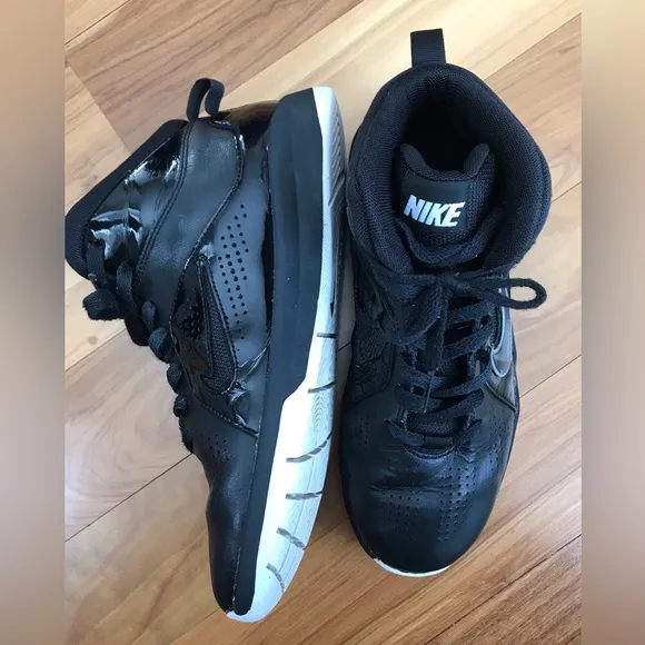 Nike | Youth black high top lace up shoes with white non-marking soles, size 5.5