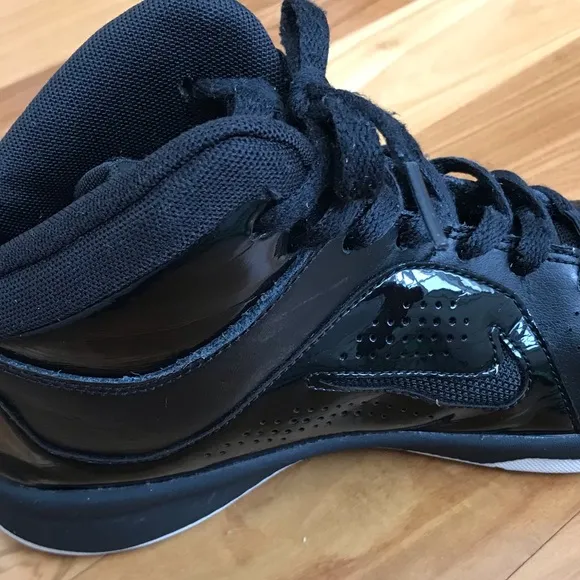 Nike | Youth black high top lace up shoes with white non-marking soles, size 5.5