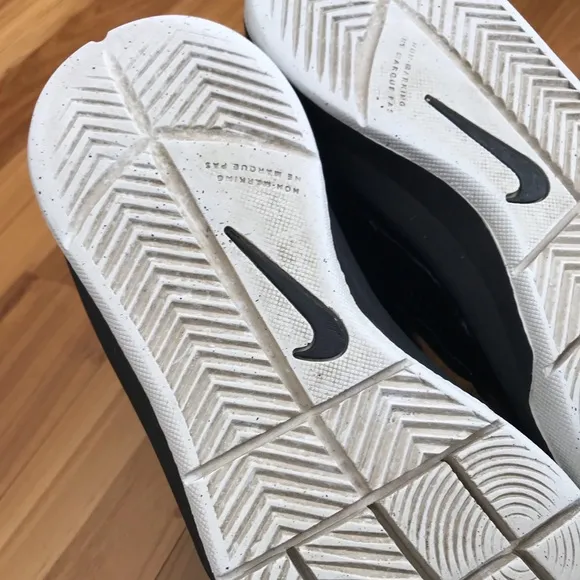 Nike | Youth black high top lace up shoes with white non-marking soles, size 5.5