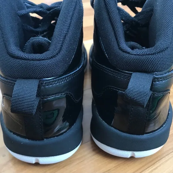Nike | Youth black high top lace up shoes with white non-marking soles, size 5.5