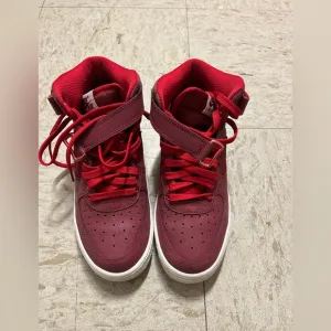Red high top Nike shoes